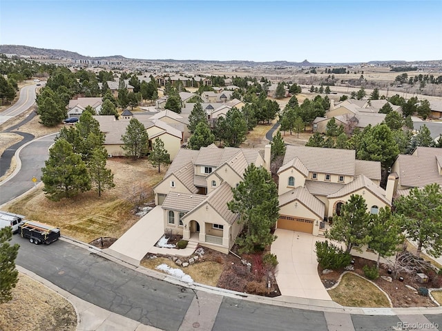 birds eye view of property with a residential view and a mountain view