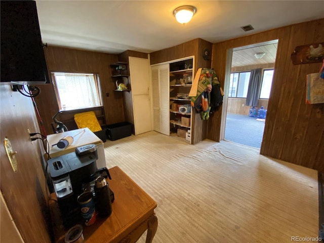 12729 Desert Dr, Sterling, CO 80751 - carpeted office space with wooden walls and plenty of natural light