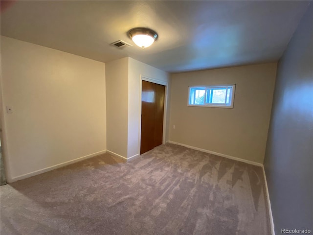 12729 Desert Dr, Sterling, CO 80751 - spare room featuring carpet and baseboards