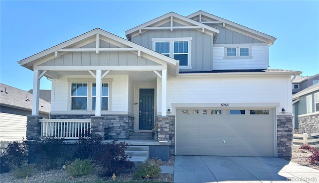 craftsman-style house featuring a porch and a garage