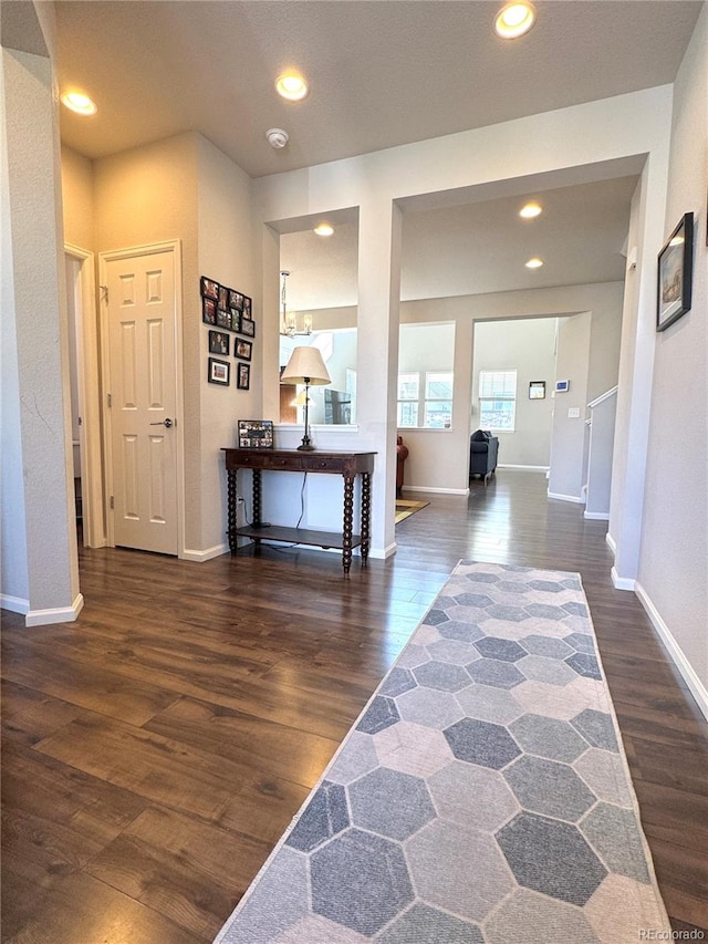 corridor featuring dark hardwood / wood-style flooring