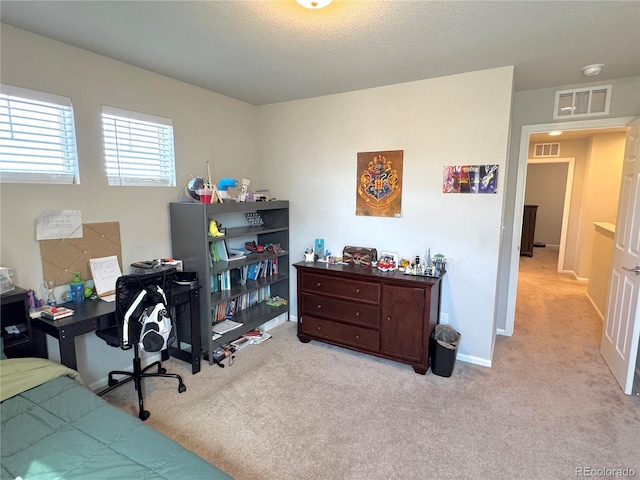 bedroom featuring light colored carpet