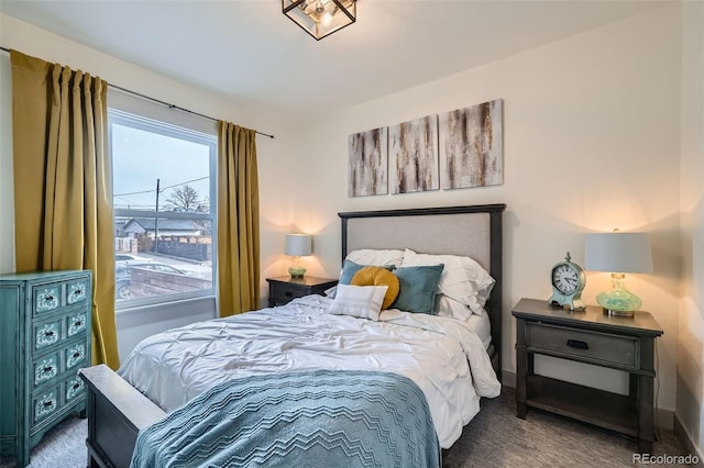 carpeted bedroom with baseboards