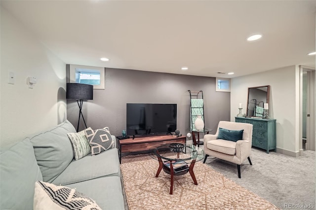 living area with light carpet, recessed lighting, and baseboards