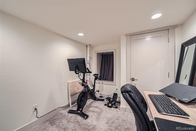 workout room with carpet, recessed lighting, baseboards, and a textured wall