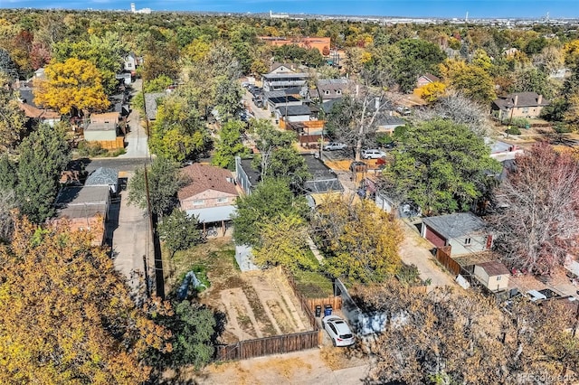 aerial view featuring a wooded view and a residential view