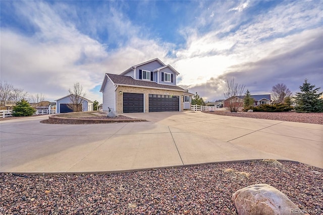 view of side of home featuring concrete driveway and brick siding