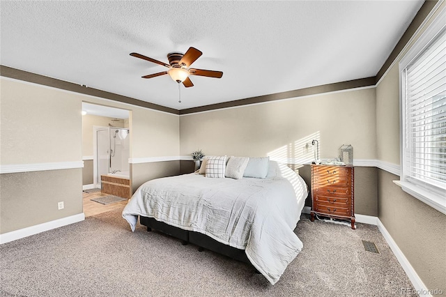 bedroom with baseboards, visible vents, a textured ceiling, and carpet flooring