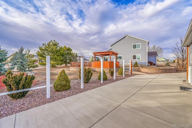 exterior space with fence and a pergola