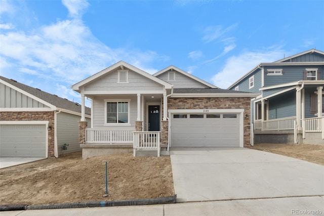 2143 Peralta Loop, Castle Rock, CO 80104 - craftsman-style house with covered porch, driveway, and an attached garage