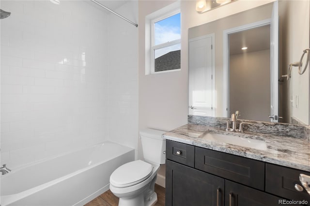 2143 Peralta Loop, Castle Rock, CO 80104 - bathroom featuring toilet, vanity, shower / bathtub combination, and wood finished floors