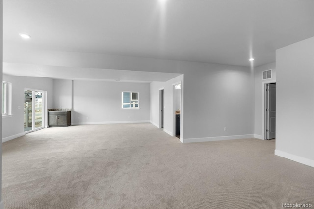 2143 Peralta Loop, Castle Rock, CO 80104 - unfurnished living room with light carpet, baseboards, and recessed lighting