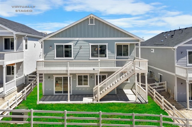 2143 Peralta Loop, Castle Rock, CO 80104 - back of house featuring board and batten siding, a fenced backyard, and a patio