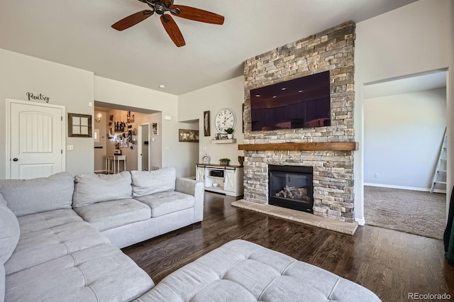 4866 Rainbow Gulch Trl, Colorado Springs, CO 80924 - living area featuring a ceiling fan, wood finished floors, and a stone fireplace