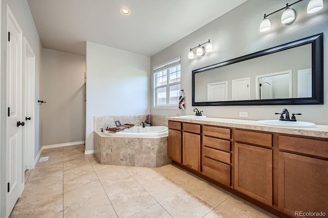4866 Rainbow Gulch Trl, Colorado Springs, CO 80924 - full bath featuring a bath, tile patterned flooring, double vanity, baseboards, and recessed lighting