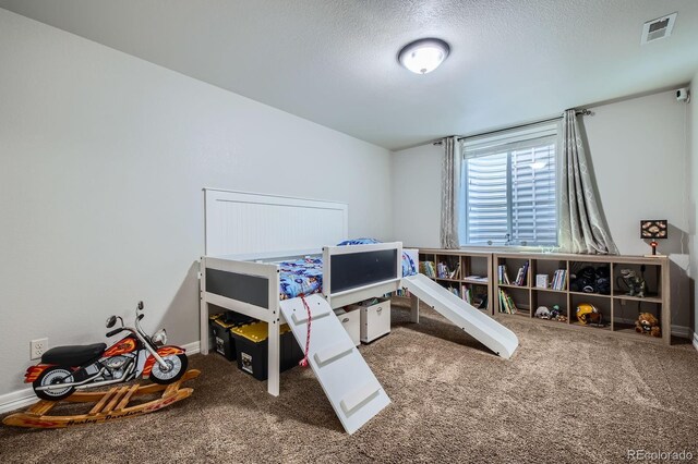 4866 Rainbow Gulch Trl, Colorado Springs, CO 80924 - bedroom with carpet flooring, a textured ceiling, and baseboards