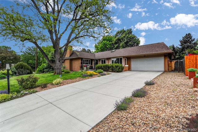 11224 W 28th Pl, Lakewood, CO 80215 - ranch-style home featuring a garage, driveway, and brick siding