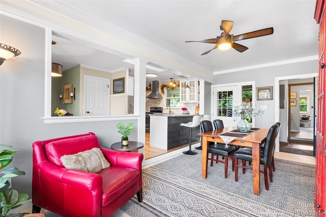 11224 W 28th Pl, Lakewood, CO 80215 - dining room featuring ceiling fan, wood finished floors, and ornamental molding