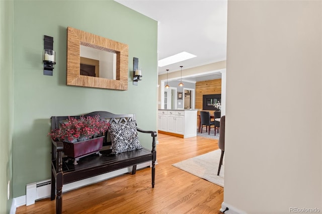 11224 W 28th Pl, Lakewood, CO 80215 - hallway with a skylight, light wood-type flooring, and baseboards