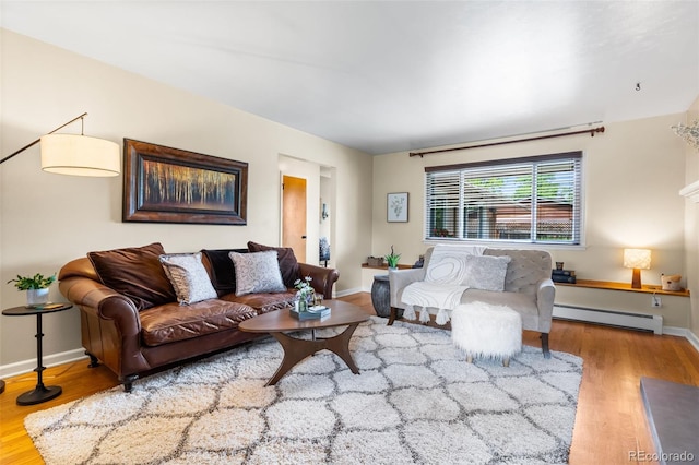 11224 W 28th Pl, Lakewood, CO 80215 - living room with a baseboard radiator, wood finished floors, and baseboards