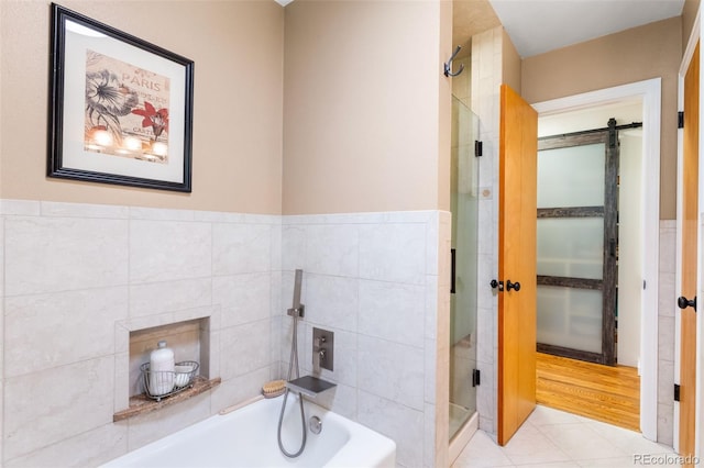 11224 W 28th Pl, Lakewood, CO 80215 - full bathroom featuring a bath, a shower stall, tile patterned flooring, and a wainscoted wall