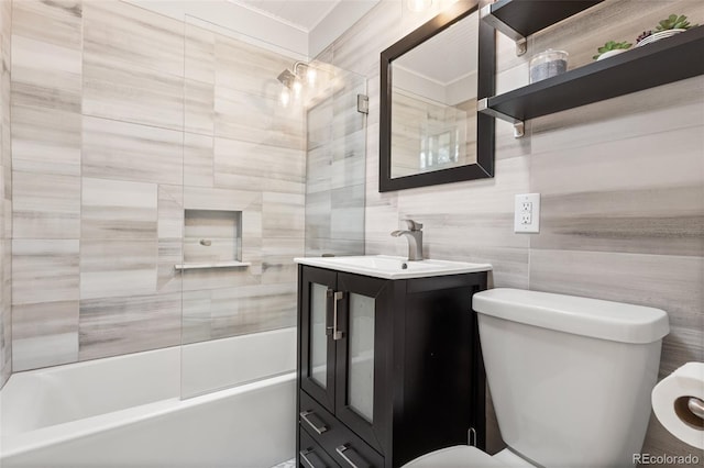 11224 W 28th Pl, Lakewood, CO 80215 - bathroom with toilet, vanity, shower / tub combination, and tile walls
