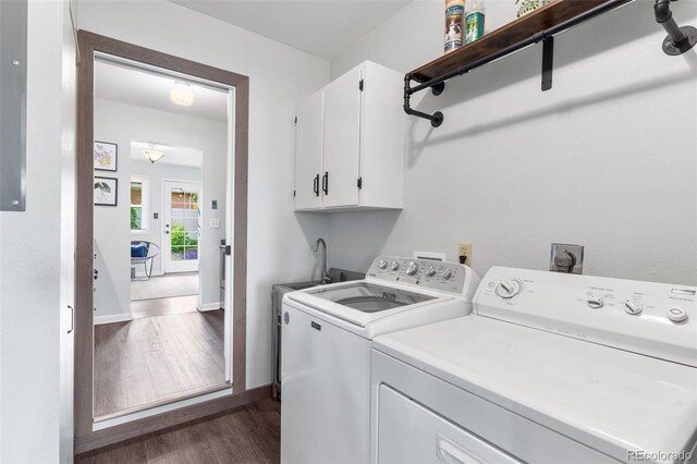 11224 W 28th Pl, Lakewood, CO 80215 - laundry area featuring cabinet space, separate washer and dryer, dark wood-style flooring, and baseboards