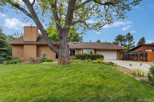 11224 W 28th Pl, Lakewood, CO 80215 - view of front of home with a chimney, an attached garage, driveway, brick siding, and a shingled roof