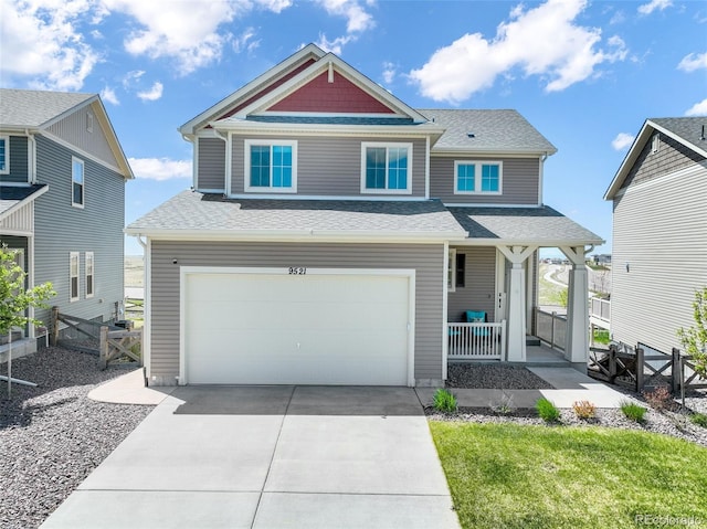 9521 Sideoats Ct, Colorado Springs, CO 80927 - view of front of property featuring a porch, a garage, concrete driveway, and roof with shingles