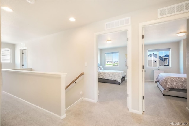 9521 Sideoats Ct, Colorado Springs, CO 80927 - corridor featuring light colored carpet, an upstairs landing, baseboards, and recessed lighting
