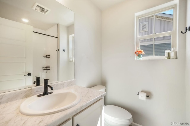 9521 Sideoats Ct, Colorado Springs, CO 80927 - full bathroom with toilet, vanity, and a shower