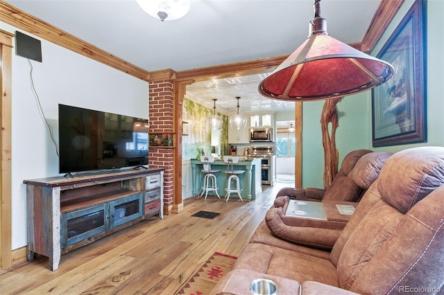4716 Broadway, Denver, CO 80216 - living area featuring light wood-style floors and ornamental molding