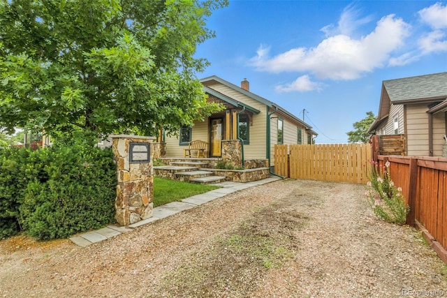 4716 Broadway, Denver, CO 80216 - view of front of house with a chimney and stone siding