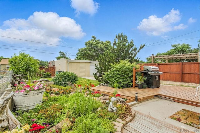 4716 Broadway, Denver, CO 80216 - fenced backyard with a deck and a storage shed