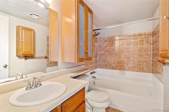 bathroom featuring washtub / shower combination, visible vents, toilet, and vanity