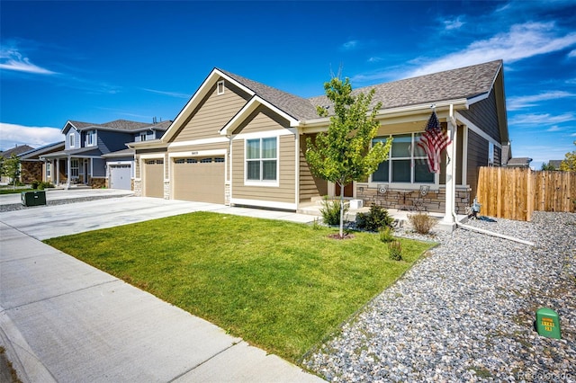 view of front of home featuring a garage and a front yard