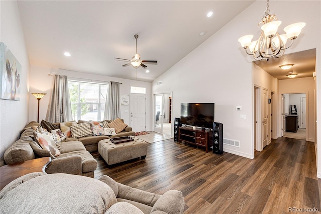 living room featuring ceiling fan with notable chandelier, dark wood-type flooring, and high vaulted ceiling