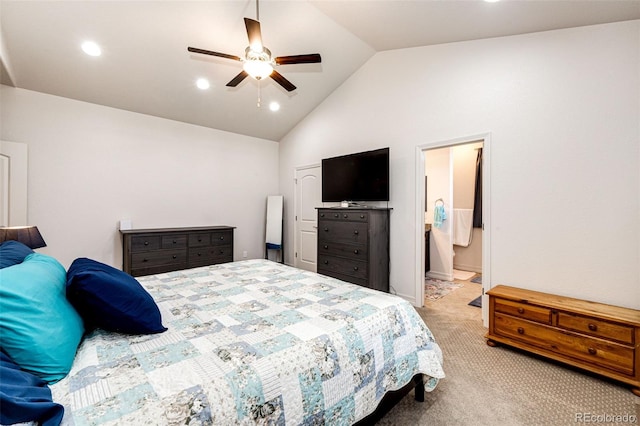 carpeted bedroom with ceiling fan, lofted ceiling, and ensuite bath