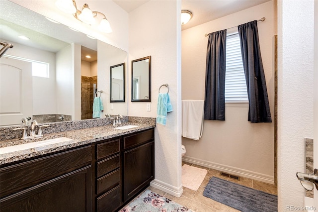 bathroom featuring walk in shower, tile patterned floors, vanity, and toilet