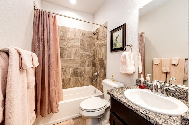 full bathroom featuring vanity, shower / bathtub combination with curtain, and toilet