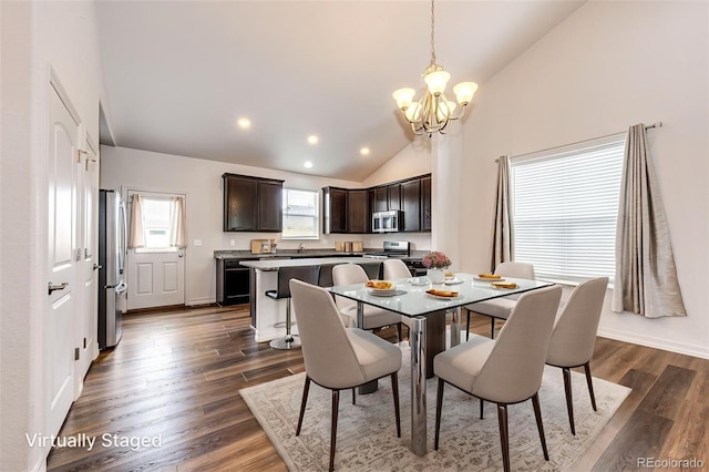 56459 E 23rd Pl, Strasburg, CO 80136 - dining room with a chandelier, lofted ceiling, dark wood-style flooring, and recessed lighting