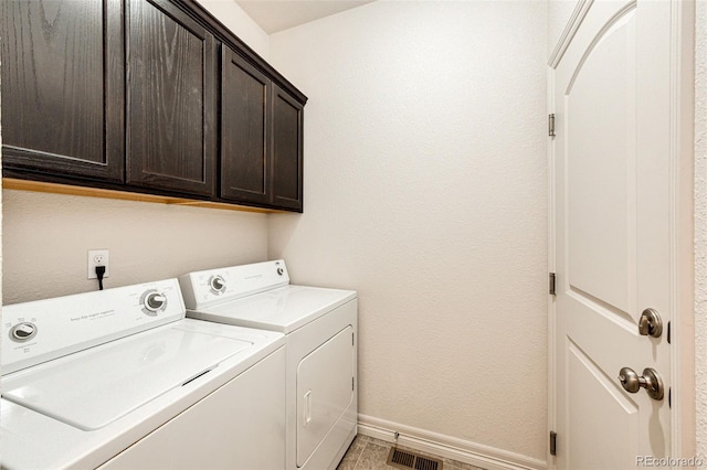 56459 E 23rd Pl, Strasburg, CO 80136 - laundry area with washing machine and clothes dryer and cabinet space