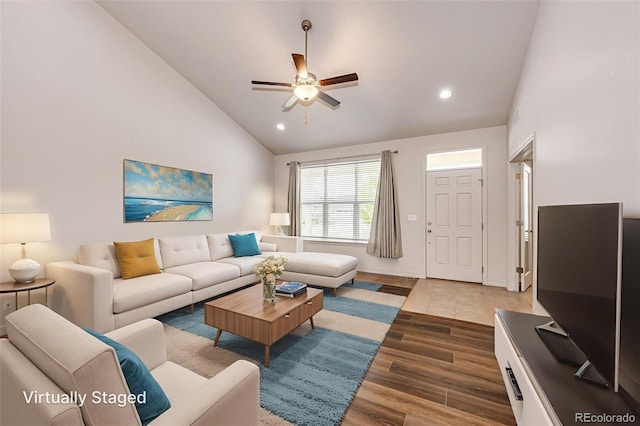 56459 E 23rd Pl, Strasburg, CO 80136 - living area featuring a ceiling fan, wood finished floors, recessed lighting, and high vaulted ceiling