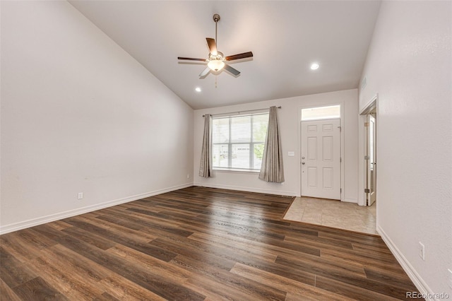 56459 E 23rd Pl, Strasburg, CO 80136 - foyer entrance featuring lofted ceiling, ceiling fan, dark wood-style flooring, and recessed lighting