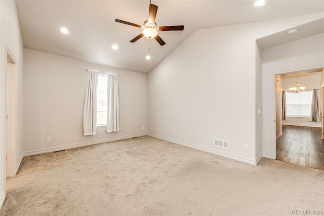 56459 E 23rd Pl, Strasburg, CO 80136 - empty room with ceiling fan, light carpet, a chandelier, lofted ceiling, and recessed lighting