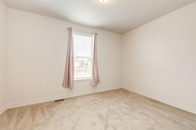 56459 E 23rd Pl, Strasburg, CO 80136 - spare room featuring carpet floors and baseboards