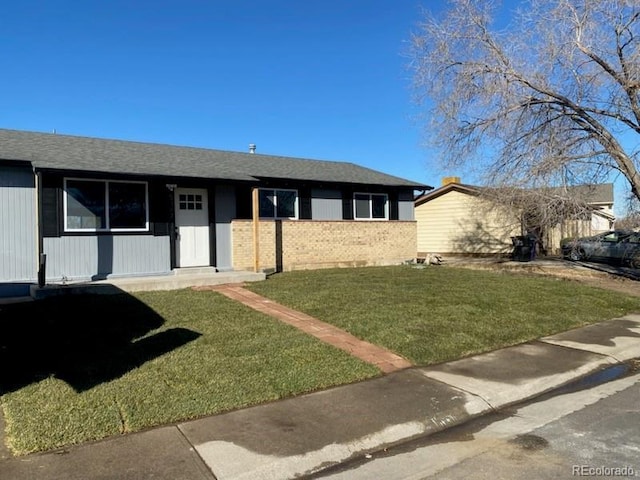 ranch-style house with a front lawn