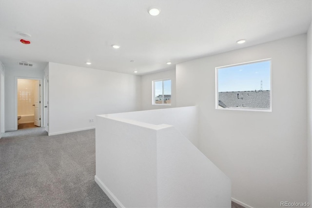 corridor featuring baseboards, recessed lighting, an upstairs landing, and visible vents