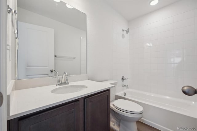 full bathroom with toilet, shower / bathing tub combination, and vanity