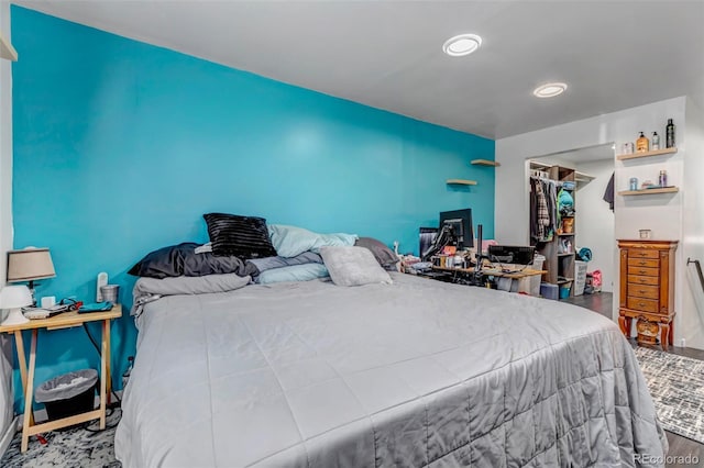 bedroom with wood finished floors